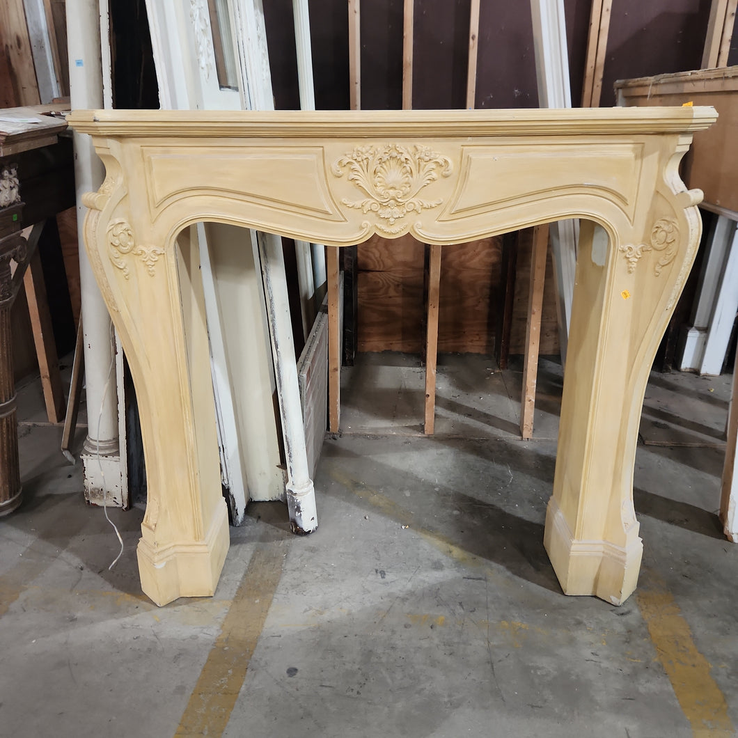 Curved Mantel with Shell Motif Trim